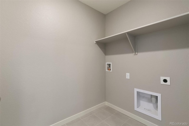 27746 E Byers Pl, Aurora, CO 80018 - washroom with hookup for a washing machine, hookup for an electric dryer, baseboards, and light tile patterned floors