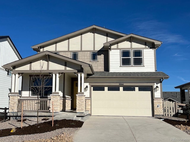 view of front of house with a porch and a garage