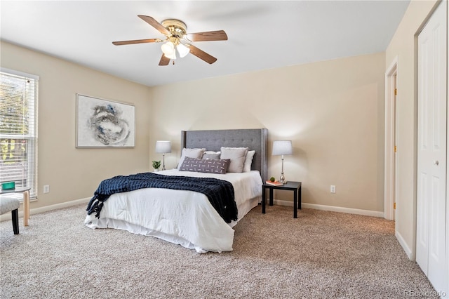 bedroom with ceiling fan, a closet, and carpet floors