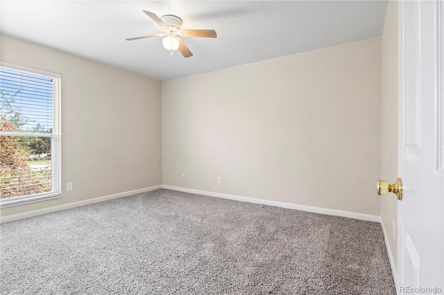 unfurnished room with carpet and ceiling fan