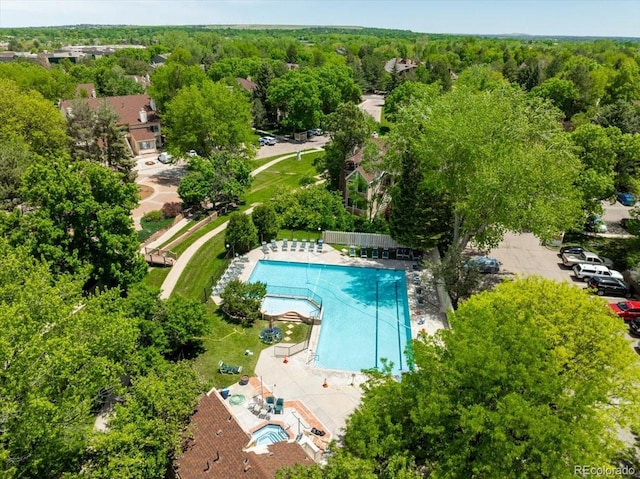 aerial view featuring a wooded view