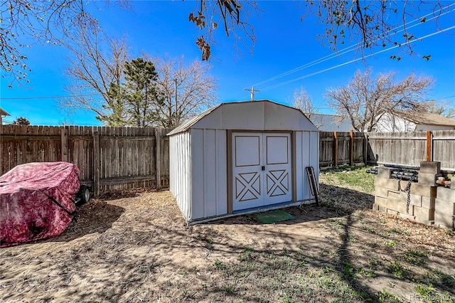 view of shed with a fenced backyard