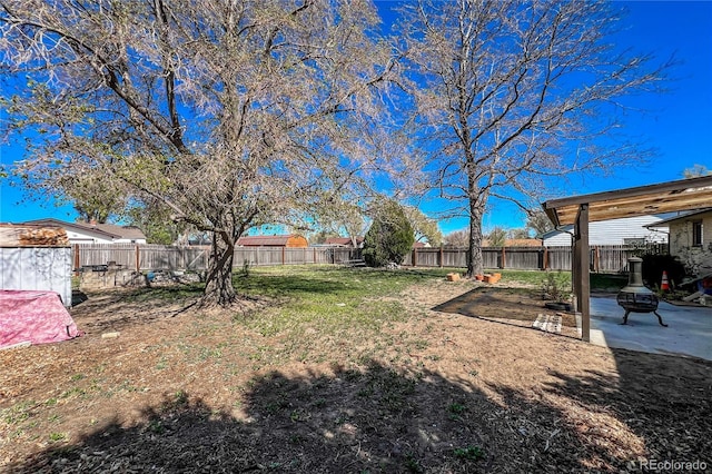 view of yard featuring a patio and a fenced backyard