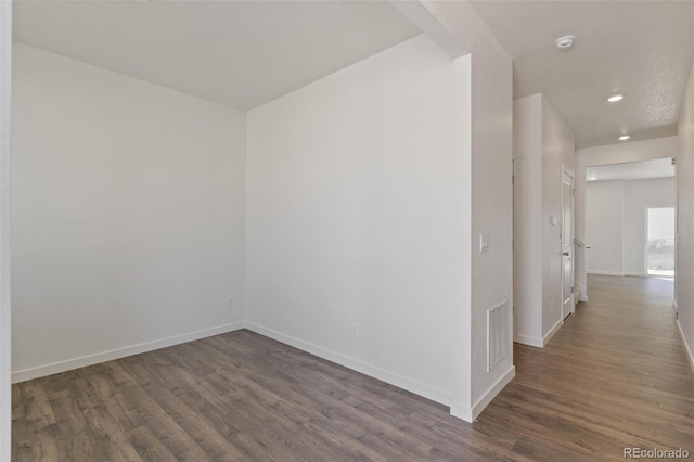 18126 Coppermallow Trl, Parker, CO 80134 - unfurnished room with dark wood finished floors, recessed lighting, and a smoke detector
