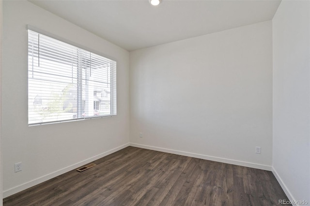 18126 Coppermallow Trl, Parker, CO 80134 - empty room with dark wood finished floors and baseboards