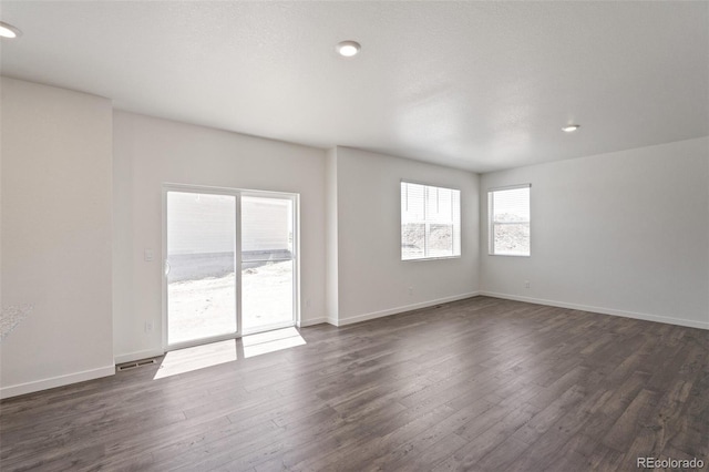 18126 Coppermallow Trl, Parker, CO 80134 - empty room with dark wood-style flooring and recessed lighting