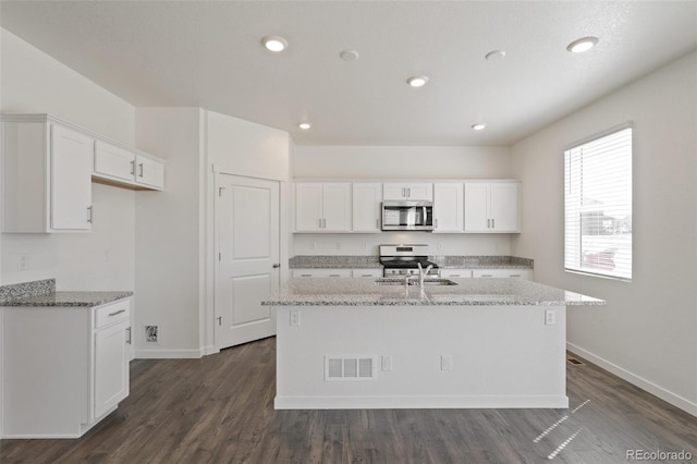 18126 Coppermallow Trl, Parker, CO 80134 - kitchen featuring stainless steel appliances, white cabinetry, an island with sink, and recessed lighting