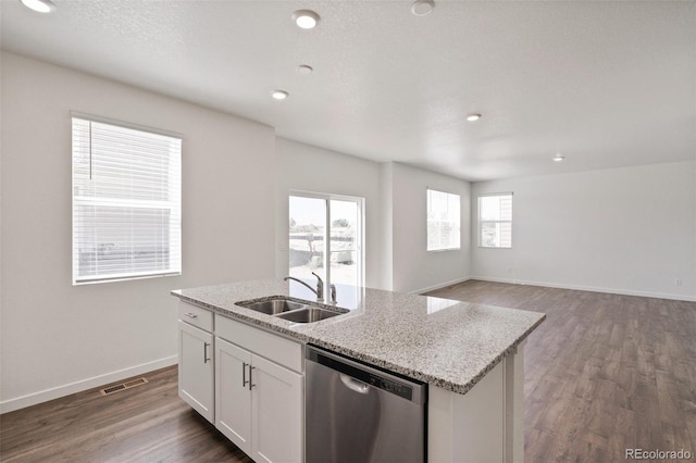 18126 Coppermallow Trl, Parker, CO 80134 - kitchen featuring dishwasher, a center island with sink, dark wood finished floors, white cabinetry, and recessed lighting