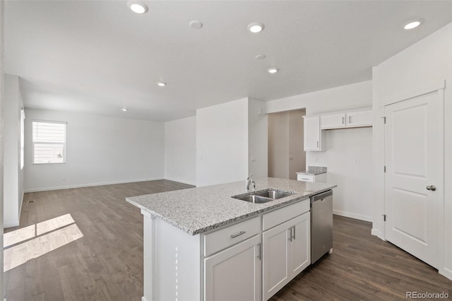 18126 Coppermallow Trl, Parker, CO 80134 - kitchen with dishwasher, white cabinets, a kitchen island with sink, light stone counters, and dark wood-style floors