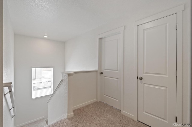 18126 Coppermallow Trl, Parker, CO 80134 - hallway featuring an upstairs landing and light colored carpet