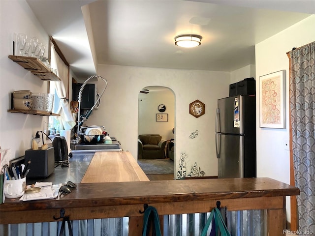 5350 Primrose Ln, Denver, CO 80221 - kitchen with freestanding refrigerator, arched walkways, and open shelves