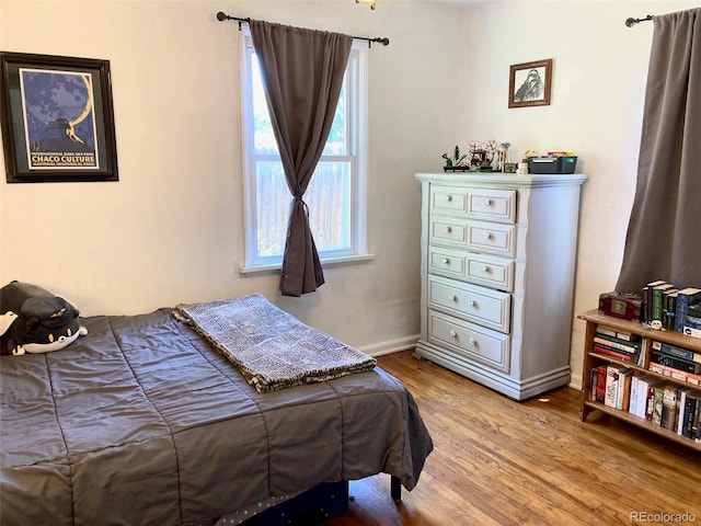 5350 Primrose Ln, Denver, CO 80221 - bedroom featuring wood finished floors and baseboards