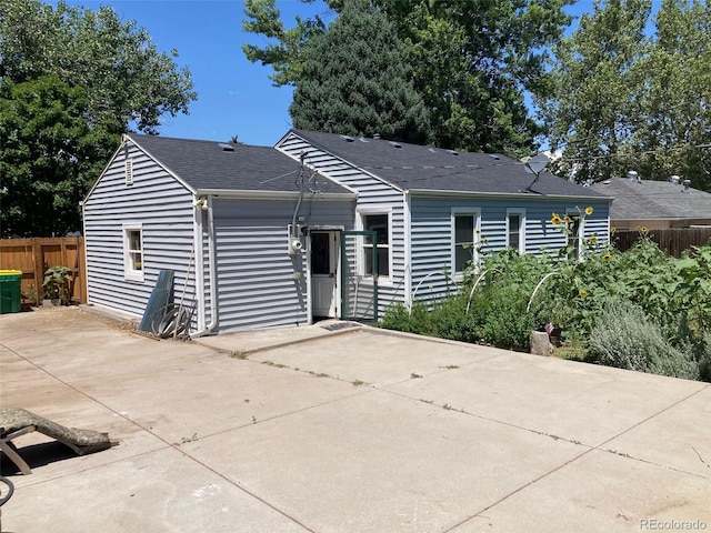 5350 Primrose Ln, Denver, CO 80221 - ranch-style house with a patio area and a shingled roof