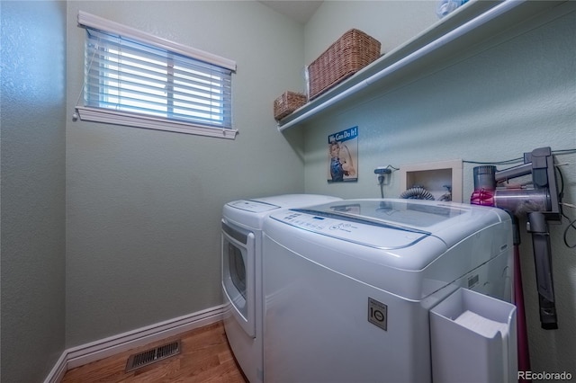 9758 Red Oakes Dr, Highlands Ranch, CO 80126 - laundry room with washing machine and dryer and wood finished floors