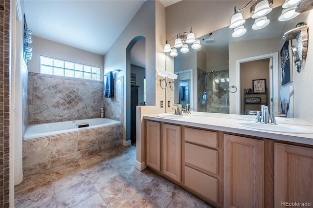 9758 Red Oakes Dr, Highlands Ranch, CO 80126 - full bath featuring tiled shower, double vanity, and tiled tub