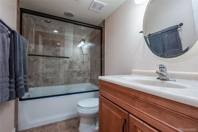 9758 Red Oakes Dr, Highlands Ranch, CO 80126 - bathroom featuring vanity, enclosed tub / shower combo, and a textured wall