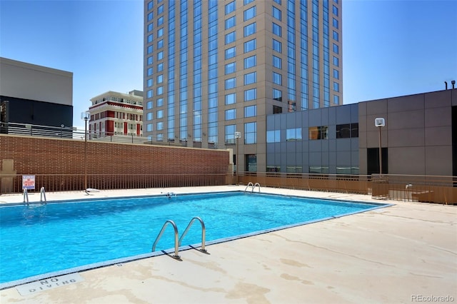 community pool with a patio