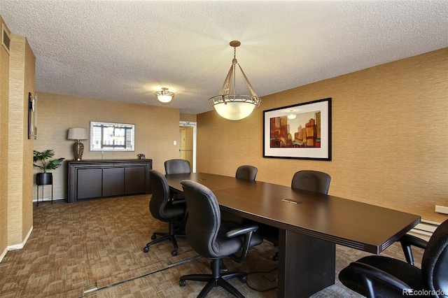 office space with a textured ceiling