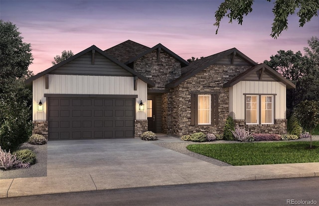 8864 S Quemoy Ct, Aurora, CO 80016 - view of front of property with stone siding, a garage, and driveway