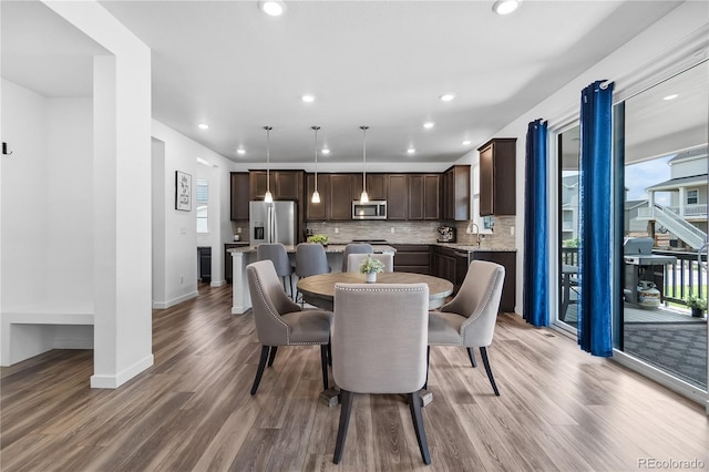 1168 Elbridge Dr, Elizabeth, CO 80107 - dining room with wood finished floors, baseboards, and recessed lighting