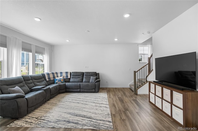 1168 Elbridge Dr, Elizabeth, CO 80107 - living area featuring plenty of natural light, wood finished floors, stairs, recessed lighting, and baseboards