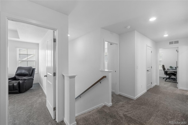 1168 Elbridge Dr, Elizabeth, CO 80107 - hall with an upstairs landing, carpet flooring, baseboards, a desk, and recessed lighting