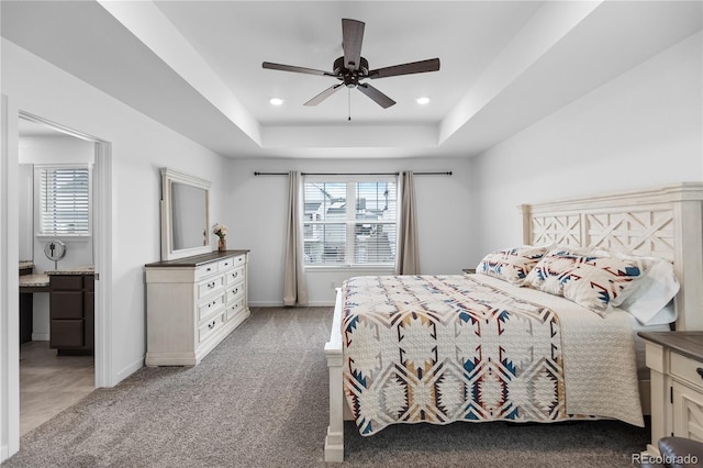 1168 Elbridge Dr, Elizabeth, CO 80107 - bedroom with multiple windows, a tray ceiling, light carpet, recessed lighting, and a ceiling fan