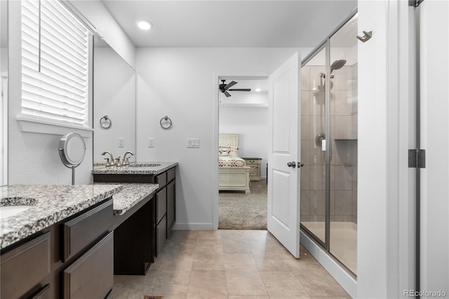 1168 Elbridge Dr, Elizabeth, CO 80107 - full bath featuring ensuite bathroom, two vanities, a stall shower, ceiling fan, and tile patterned floors