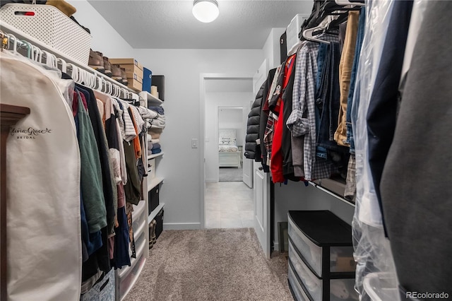 1168 Elbridge Dr, Elizabeth, CO 80107 - walk in closet featuring tile patterned floors and carpet floors