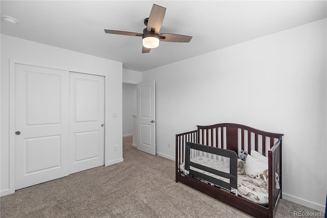 1168 Elbridge Dr, Elizabeth, CO 80107 - carpeted bedroom featuring baseboards, a closet, a crib, and ceiling fan