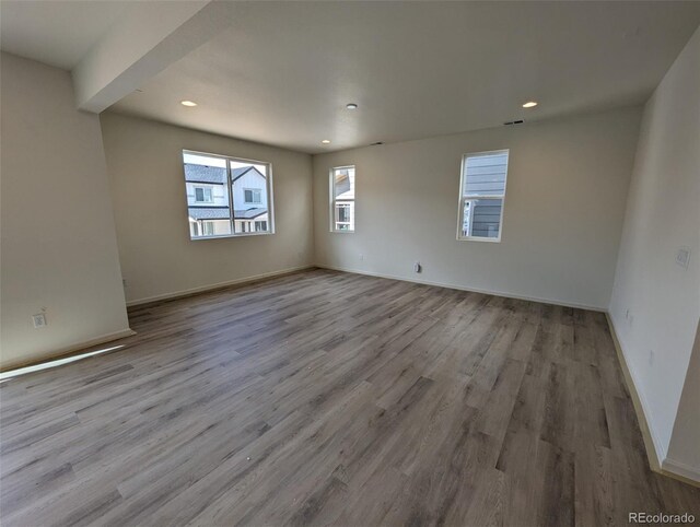 empty room with wood-type flooring