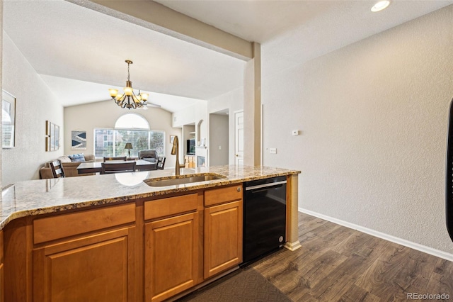 kitchen with a sink, light stone counters, dishwasher, and dark wood-style floors