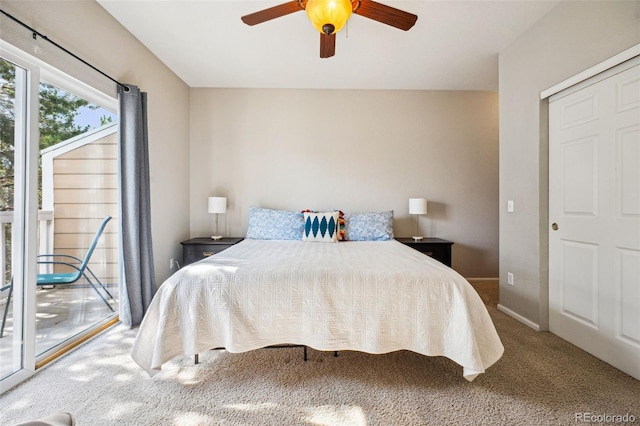 carpeted bedroom featuring baseboards, access to exterior, and a ceiling fan