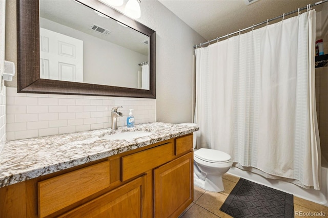 full bath featuring vanity, visible vents, tile patterned flooring, toilet, and tasteful backsplash