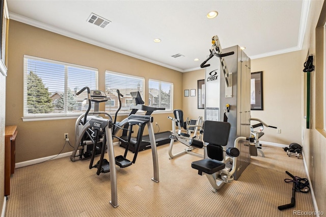 workout room with visible vents, baseboards, and ornamental molding