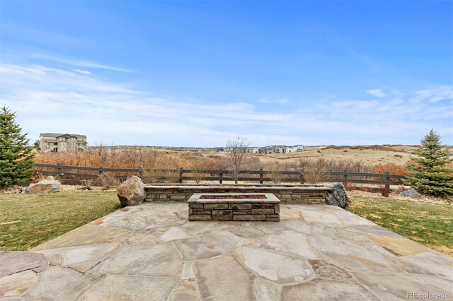 7077 Copper Sky Cir, Castle Pines, CO 80108 - view of patio with an outdoor fire pit and fence