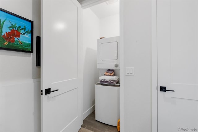 7077 Copper Sky Cir, Castle Pines, CO 80108 - hallway featuring stacked washer / dryer