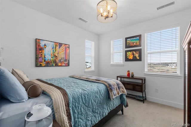 7077 Copper Sky Cir, Castle Pines, CO 80108 - bedroom with a chandelier, light carpet, and baseboards