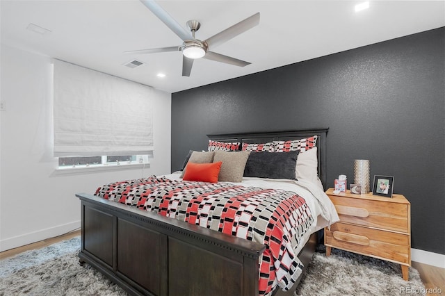 7077 Copper Sky Cir, Castle Pines, CO 80108 - bedroom with wood finished floors, baseboards, a ceiling fan, and a textured wall