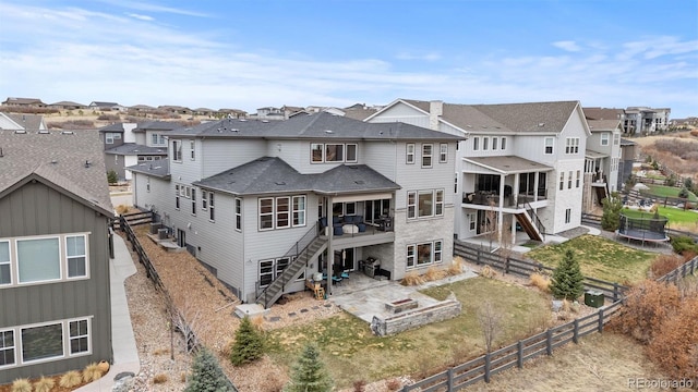 7077 Copper Sky Cir, Castle Pines, CO 80108 - back of house featuring stairway, a residential view, a fenced backyard, and a wooden deck