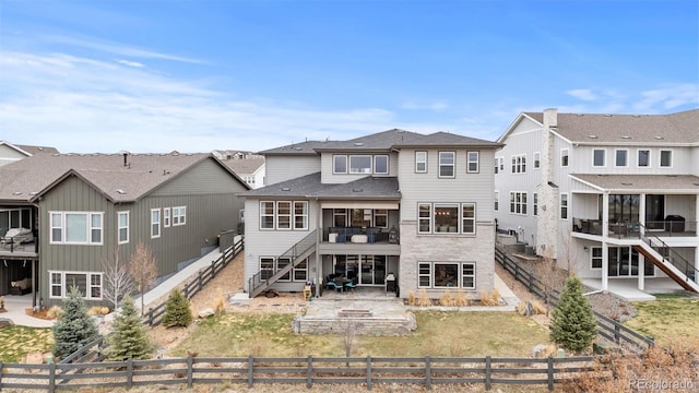 7077 Copper Sky Cir, Castle Pines, CO 80108 - back of property with stairway, a fenced backyard, and a residential view