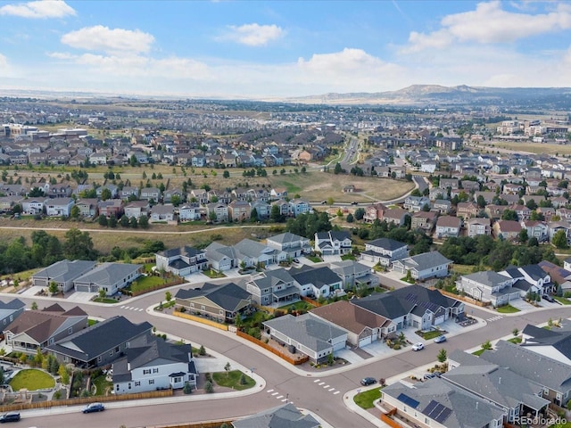 birds eye view of property with a mountain view