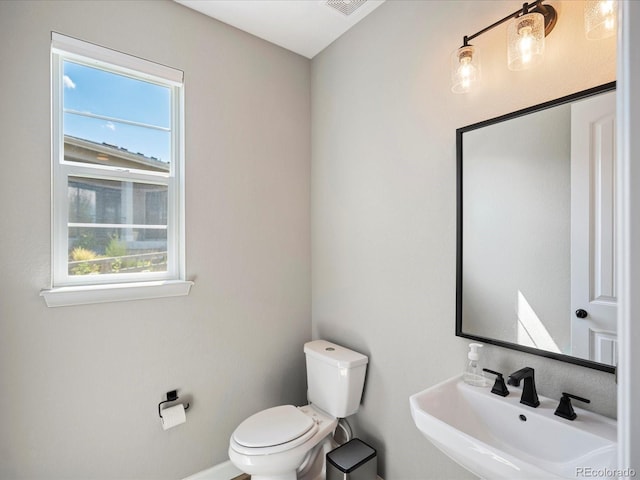 bathroom with sink and toilet