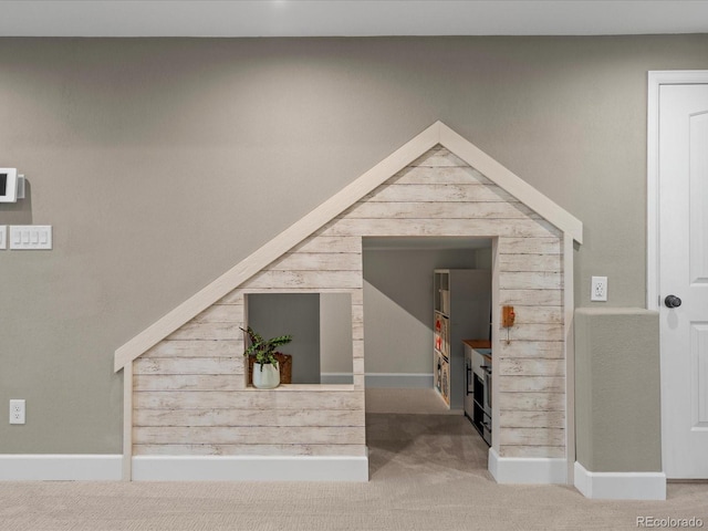 stairway featuring carpet floors