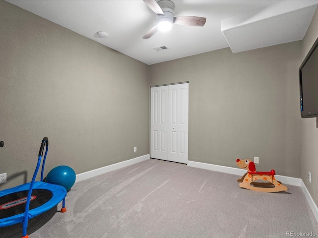 recreation room with ceiling fan and carpet floors