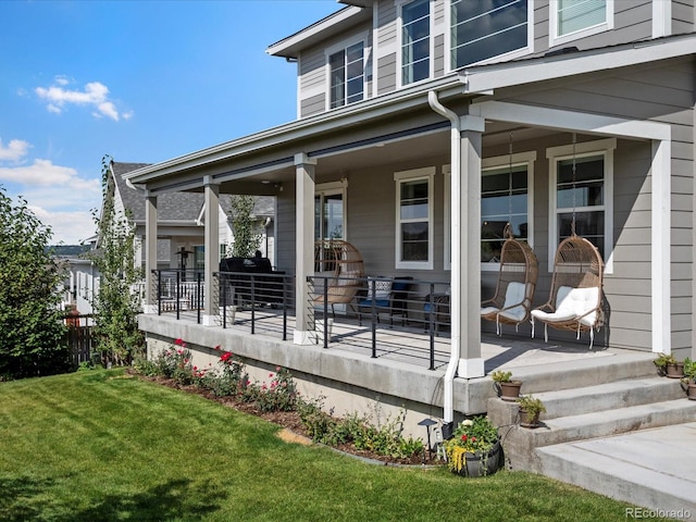 deck with a yard and covered porch