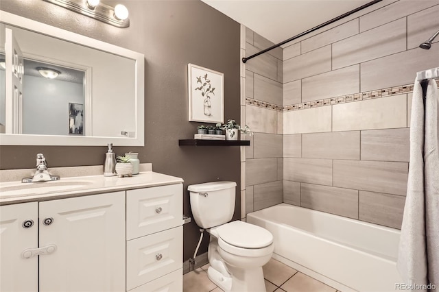 bathroom with toilet, tub / shower combination, vanity, tile patterned flooring, and baseboards