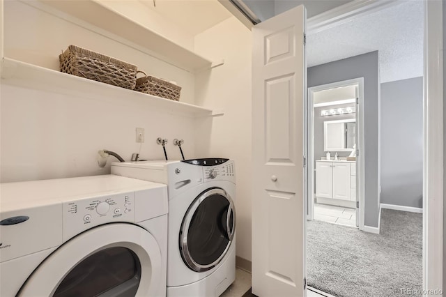 clothes washing area featuring laundry area, separate washer and dryer, carpet floors, and baseboards