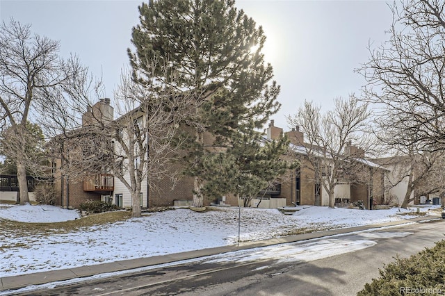 view of front of house featuring a chimney