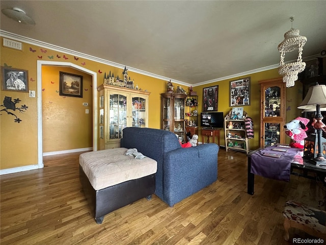 260 Sheridan Blvd, Denver, CO 80226 - living area with wood finished floors, crown molding, a chandelier, and baseboards